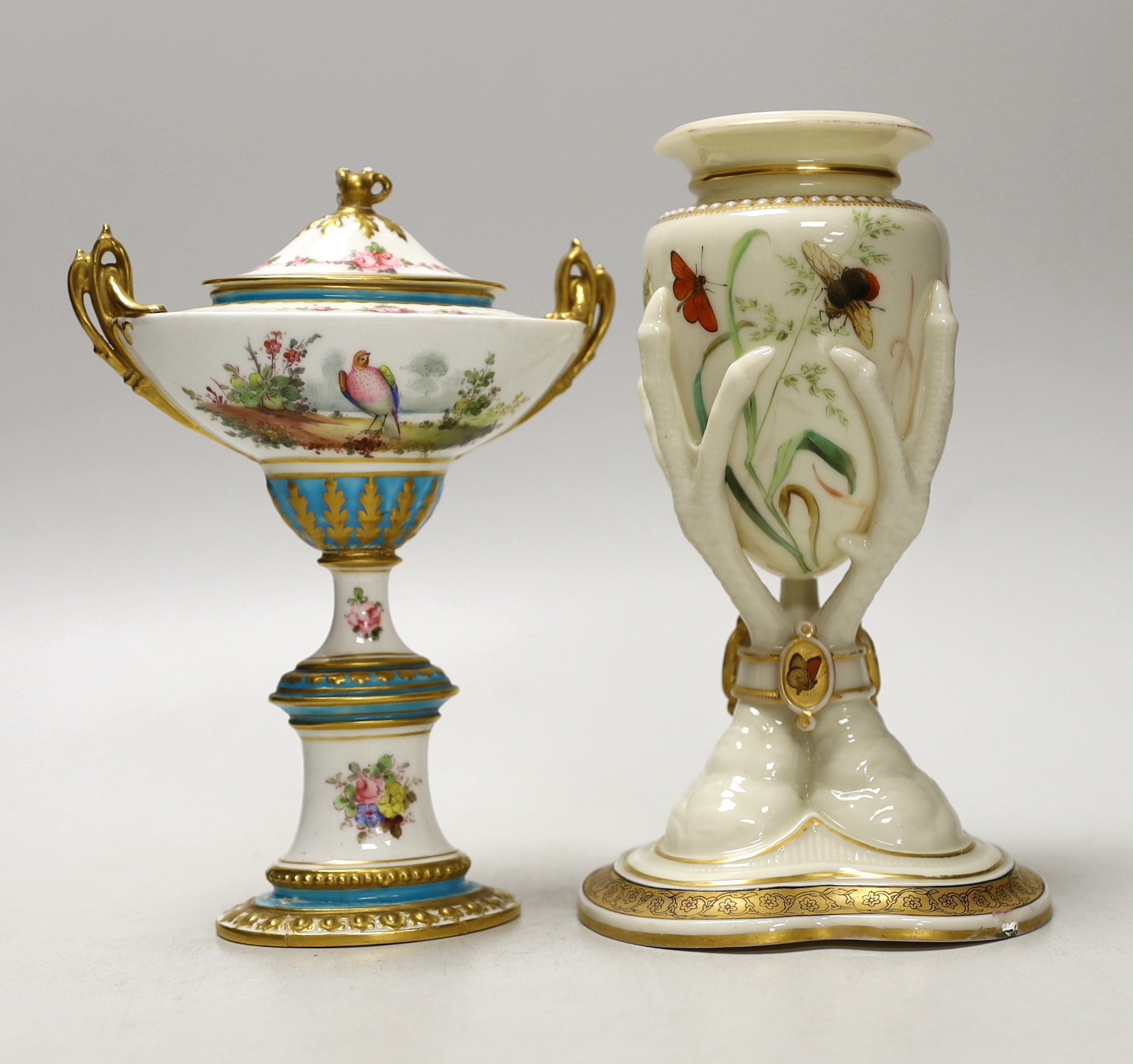 A Royal Worcester urn, modelled as three birds legs holding an oviform vase and a Royal Crown Derby two handled urn and cover on stand, Worcester urn 17cms high